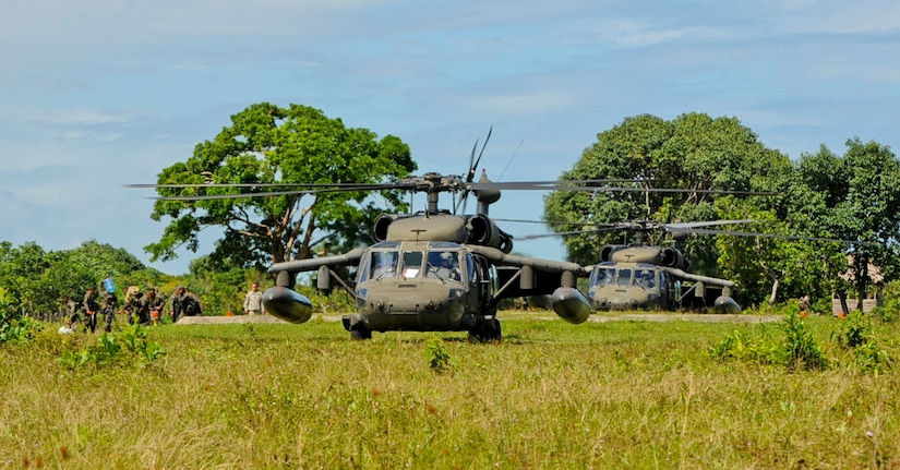 Two U.S. Army UH-60 Blackhawks assigned to the 1-228th Aviation Regiment take on Honduran soldiers, Nov. 5, 2015, in the Gracias a Dios department (state) of Honduras, during an ongoing partnership between the U.S. and Honduras to aid the Honduran military’s freedom of movement in the area. Over 300 Honduran soldiers were rotated to and from various forward operating locations to help prevent the trafficking of people and drugs in the area. (U.S. Air Force photo by Capt. Christopher J. Mesnard/Released)