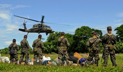 A U.S. Army UH-60 Blackhawk takes off with Honduran soldiers and their equipment, Nov. 5, 2015, in the Gracias a Dios department (state) of Honduras as other soldiers await transport to forward operating posts in the area. The helicopters, assigned to the 1-228th Aviation Regiment at Soto Cano Air Base, Honduras, fulfilled a Honduran military request for airlift to aid in their freedom of movement in the area, helping them to combat drug trafficking and related criminal activities. (U.S. Air Force photo by Capt. Christopher J. Mesnard/Released)