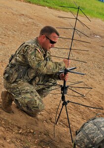 U.S. Army Capt. John Dills, Joint Task Force-Bravo officer in charge, sets up an antenna for communications capabilities during the Honduran troop movement, Operation CARAVANA XIII, Nov. 4, 2015, in the Gracias a Dios department (state) of Honduras. Dills provided command and control capabilities for the Honduran troop movement, which U.S. Army UH-60 Blackhawks supported with airlift capabilities, giving the Hondurans greater freedom of movement to counter drug trafficking and related criminal activities. (U.S. Air Force photo by Capt. Christopher J. Mesnard/Released)