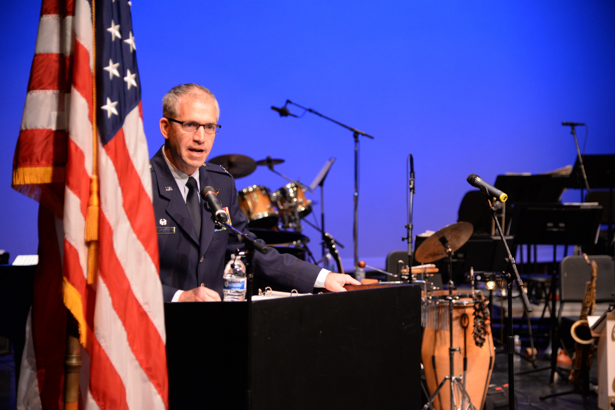 Col. Joel Jackson, 60th Air Mobility Wing commander, spoke to more than 100 Veterans Nov. 11 at the Downtown Theater in Fairfield, Calif., during a Veterans Day commemoration ceremony. (U.S. Air Force photo by Master Sgt. Brian Lamar)