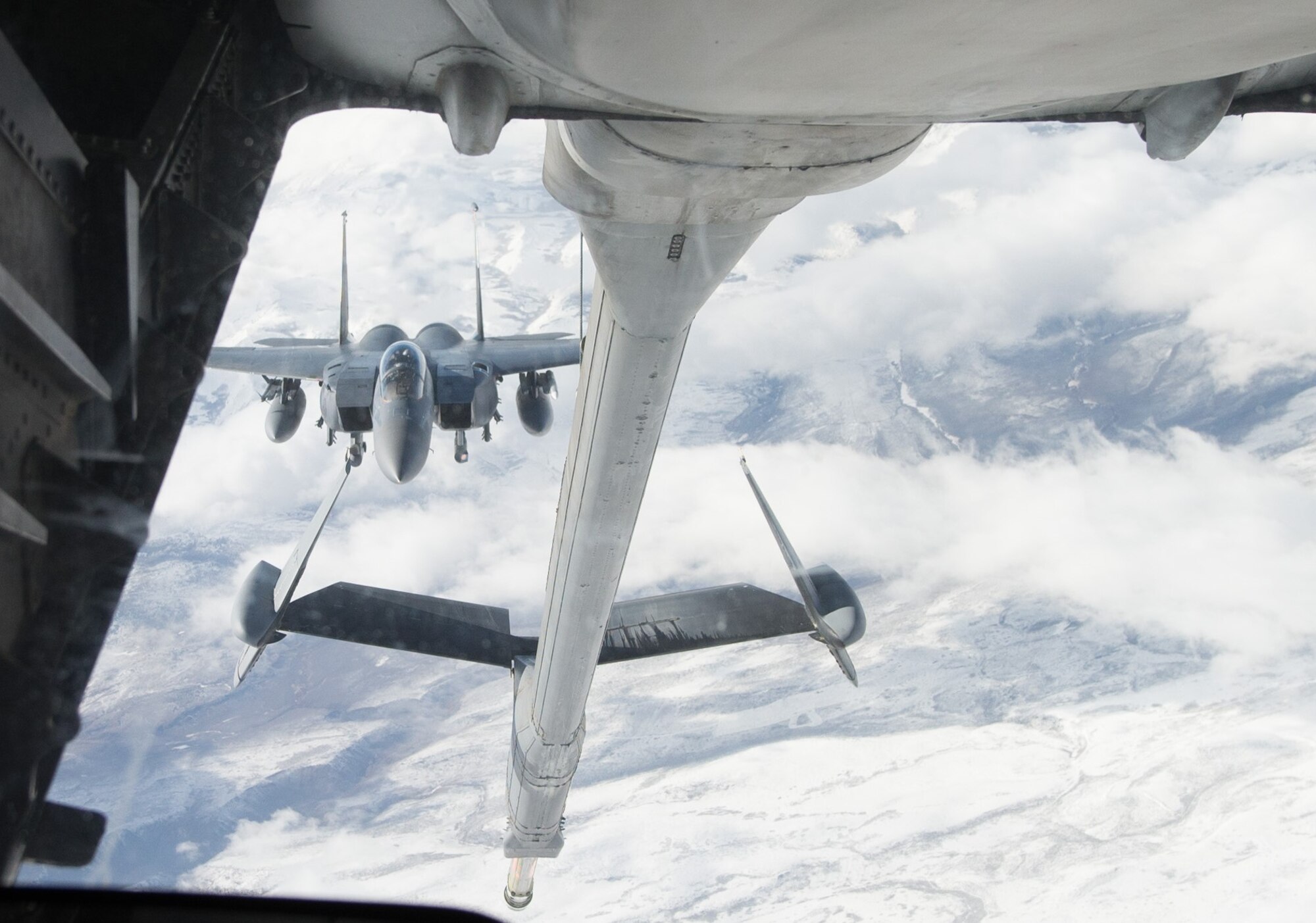 A KC-10 Extender from Travis Air Force Base, Calif., refuels an F-15E Strike Eagle Nov. 5 from Mountain Home Air Force Base, Idaho. Travis participated in exercise Gunfighter Flag from Nov. 2 to 6 gaining valuable training practice. (U.S. Air Force photos by Airman 1st Class Amber Carter)