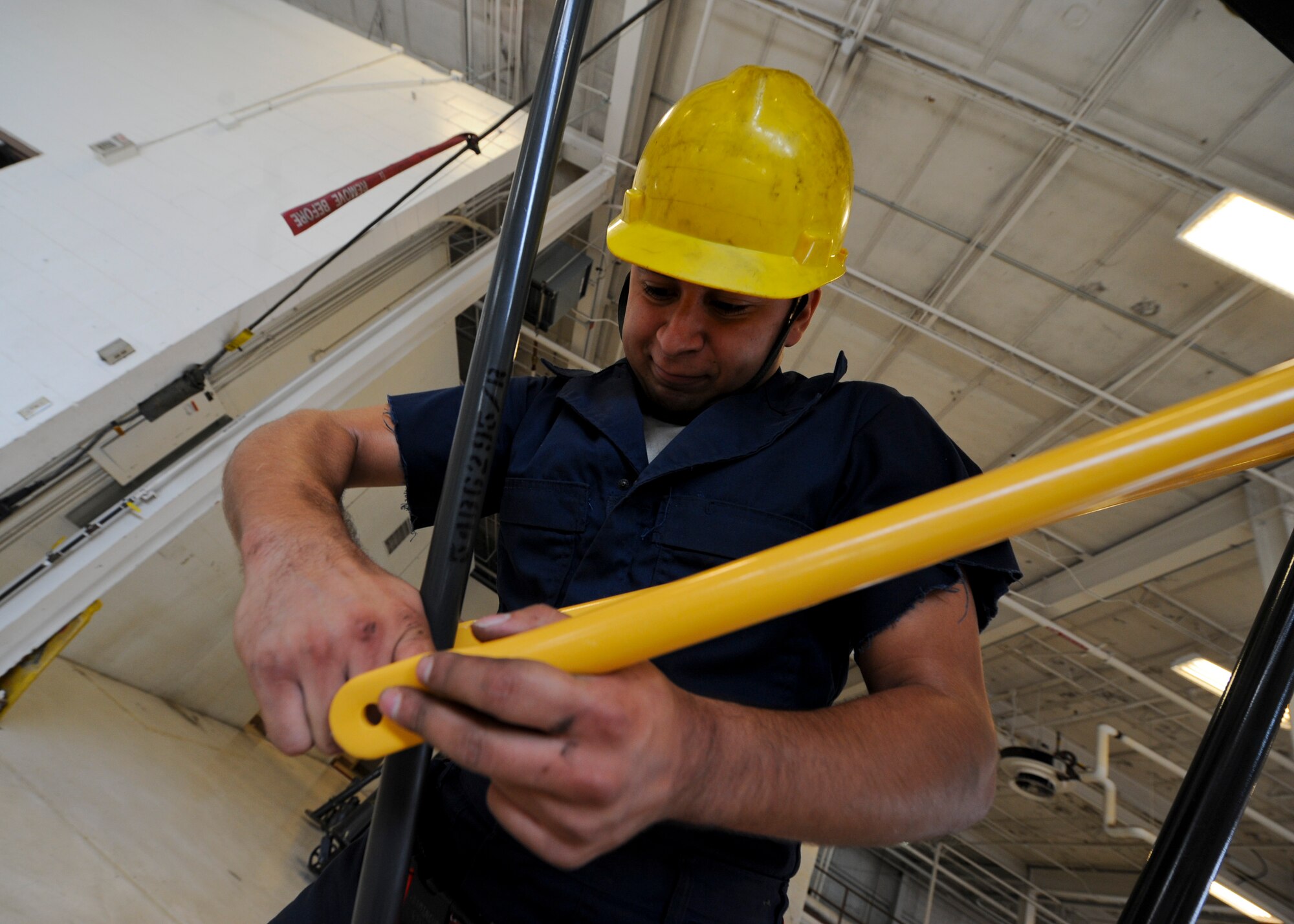 Senior Airman Jose Dominguez, 22nd Maintenance Squadron aerospace ground equipment flight journeyman, secures braces on a B-5 stand, Nov. 5, 2015, at McConnell Air Force Base, Kan. The AGE flight is responsible for maintaining and providing gear to other maintenance Air Force specialty codes for aircraft troubleshooting. (U.S. Air Force photo/Senior Airman Victor J. Caputo)