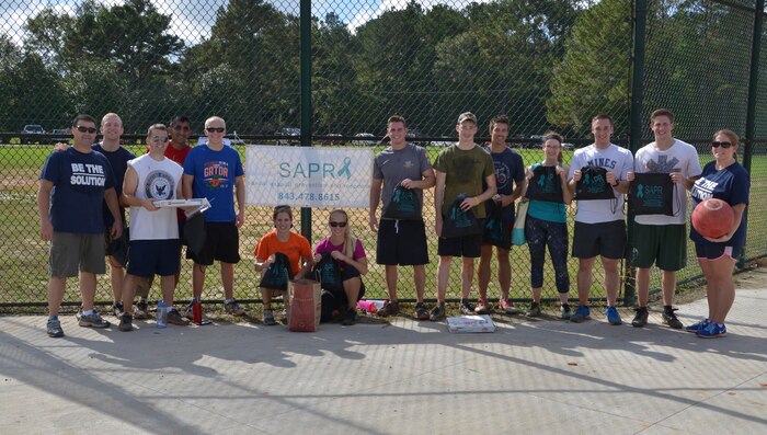 Members of the “Helm’s Deep” kickball team representing Naval Nuclear Power Training Unit pose for a group photo after winning the kickball tournament on Joint Base Charleston - Weapons Station Nov. 7, 2015. The event was hosted by the Navy’s Sexual Assault Prevention and Response team. (U.S. Navy photo by Mass Communication 3rd Class John Haynes/Released)