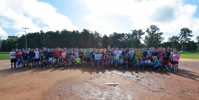 Service members assigned to various commands on Joint Base Charleston - Weapons Station pose for a group photo before a kickball tournament Nov. 7, 2015. Twenty teams participated in the event hosted by the Navy’s Sexual Assault Prevention and Response team. (U.S. Navy photo by Mass Communication 2nd Class Jason Pastrick/Released)