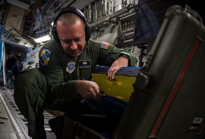 Staff Sgt. Lee Vickery, from the 437th Aircraft Maintenance Squadron, searches his tool box after landing in Zaragoza, Spain, Nov. 4, 2015, during exercise Ultimate Reach 16-1. The exercise is an annual U.S. Transportation Command sponsored, live-fly exercise designed to test the ability of 18th Air Force to plan and conduct strategic airdrop missions with the 82nd Airborne Division. Four C-17 Globemaster IIIs from the 437th Airlift Squadron out of Joint Base Charleston, S.C., participated in a seven-ship formation to help airdrop more than 500 U.S. Army and Spanish military jumpers in Zaragoza, Spain. (U.S. Air Force photo/Senior Airman Jared Trimarchi)