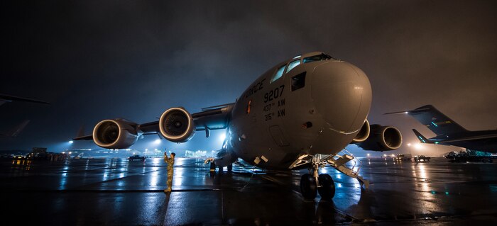 A Soldier assigned to the 82nd Airborne Division tests his communications gear at Pope Army Airfield, N.C., Nov. 3, 2015, during exercise Ultimate Reach 16-1. The exercise is an annual U.S. Transportation Command sponsored, live-fly exercise designed to test the ability of 18th Air Force to plan and conduct strategic airdrop missions with the 82nd Airborne Division. Four C-17 Globemaster IIIs from the 437th Airlift Squadron out of Joint Base Charleston, S.C., participated in a seven-ship formation to help airdrop more than 500 U.S. Army and Spanish military jumpers in Zaragoza, Spain. (U.S. Air Force photo/Senior Airman Jared Trimarchi)