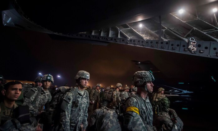 More than 60 Soldiers from the 82nd Airborne Division prepare to enter the back of a C-17 Globemaster III at Pope Army Airfield, N.C., Nov. 3, 2015, during exercise Ultimate Reach 16-1. The exercise is an annual U.S. Transportation Command sponsored, live-fly exercise designed to test the ability of 18th Air Force to plan and conduct strategic airdrop missions with the 82nd Airborne Division. Four C-17 Globemaster IIIs from the 437th Airlift Squadron out of Joint Base Charleston, S.C., participated in a seven-ship formation to help airdrop more than 500 U.S. Army and Spanish military jumpers in Zaragoza, Spain. (U.S. Air Force photo/Senior Airman Jared Trimarchi)