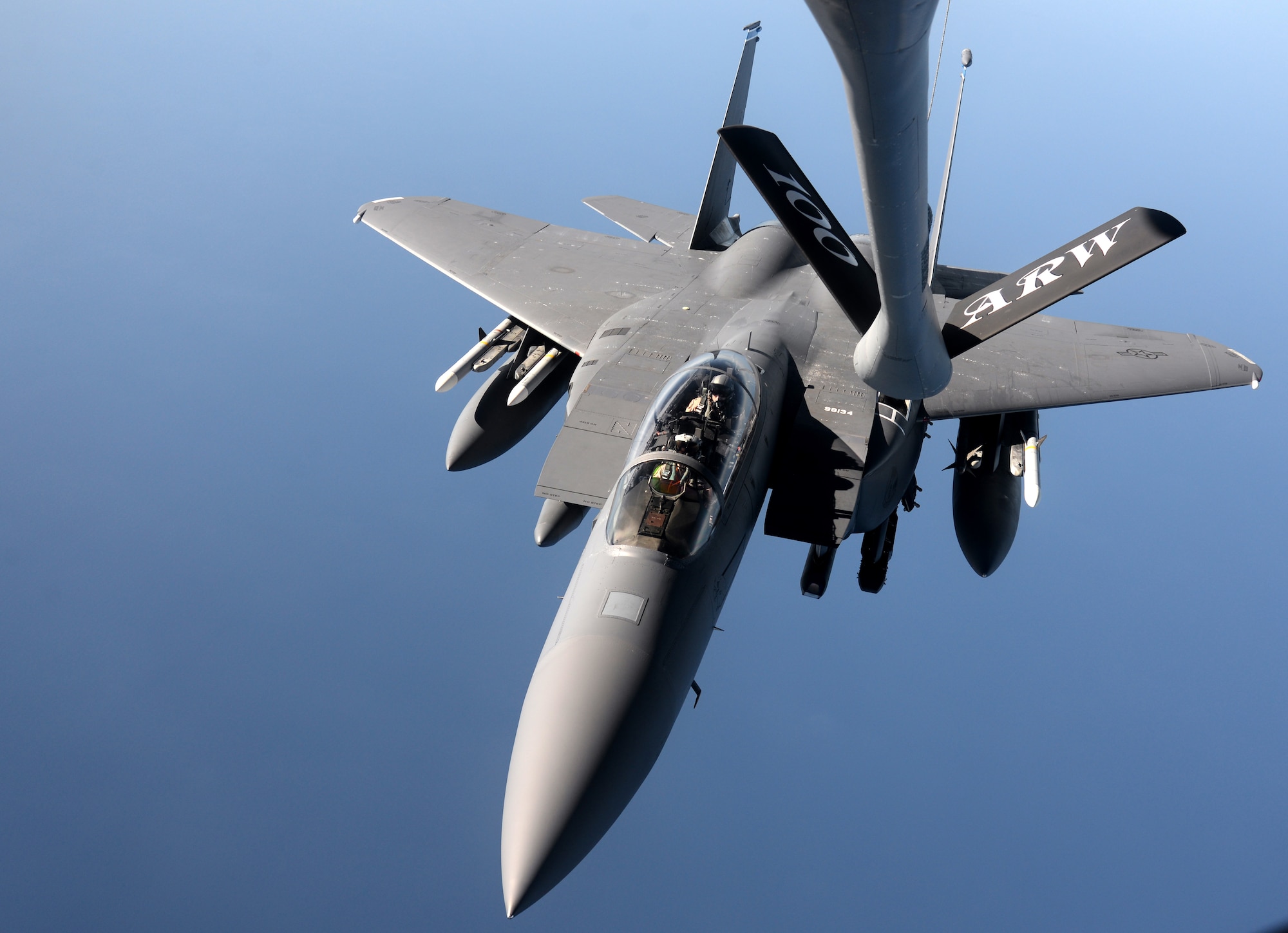 An F-15E Strike Eagle from the 48th Fighter Wing approaches a KC-135 Stratotanker from the 100th Air Refueling Wing for refueling Nov. 12, 2015, over the northern Mediterranean. While deployed to Incirlik Air Base, Turkey, both wings will work together in support of Operation Inherent Resolve counter-ISIL operations in Iraq and Syria. (U.S. Air Force photo by Senior Airman Kate Thornton/Released)