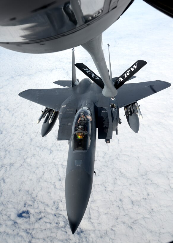An F-15E Strike Eagle from the 48th Fighter Wing approaches a KC-135 Stratotanker from the 100th Air Refueling Wing for refueling Nov. 12, 2015, over the northern Mediterranean. While deployed to Incirlik Air Base, Turkey, both wings will work together in support of Operation Inherent Resolve counter-ISIL operations in Iraq and Syria. (U.S. Air Force photo by Senior Airman Kate Thornton/Released)