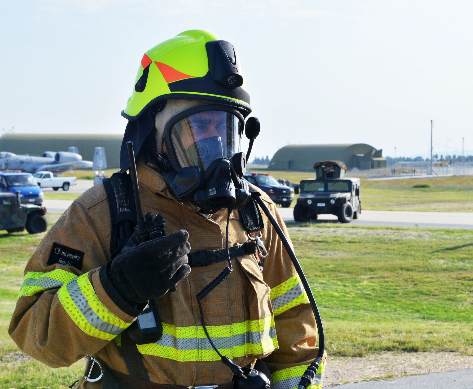 A firefighter from the 39th Civil Engineer Squadron fire department radios for assistance during a wing exercise Nov. 5, 2015, at Incirlik Air Base, Turkey. Week-long exercises are held at Incirlik AB to test the response time and capabilities of members of the 39th Air Base Wing. (U.S. Air Force photo by Staff Sgt. Michael Battles/Released)