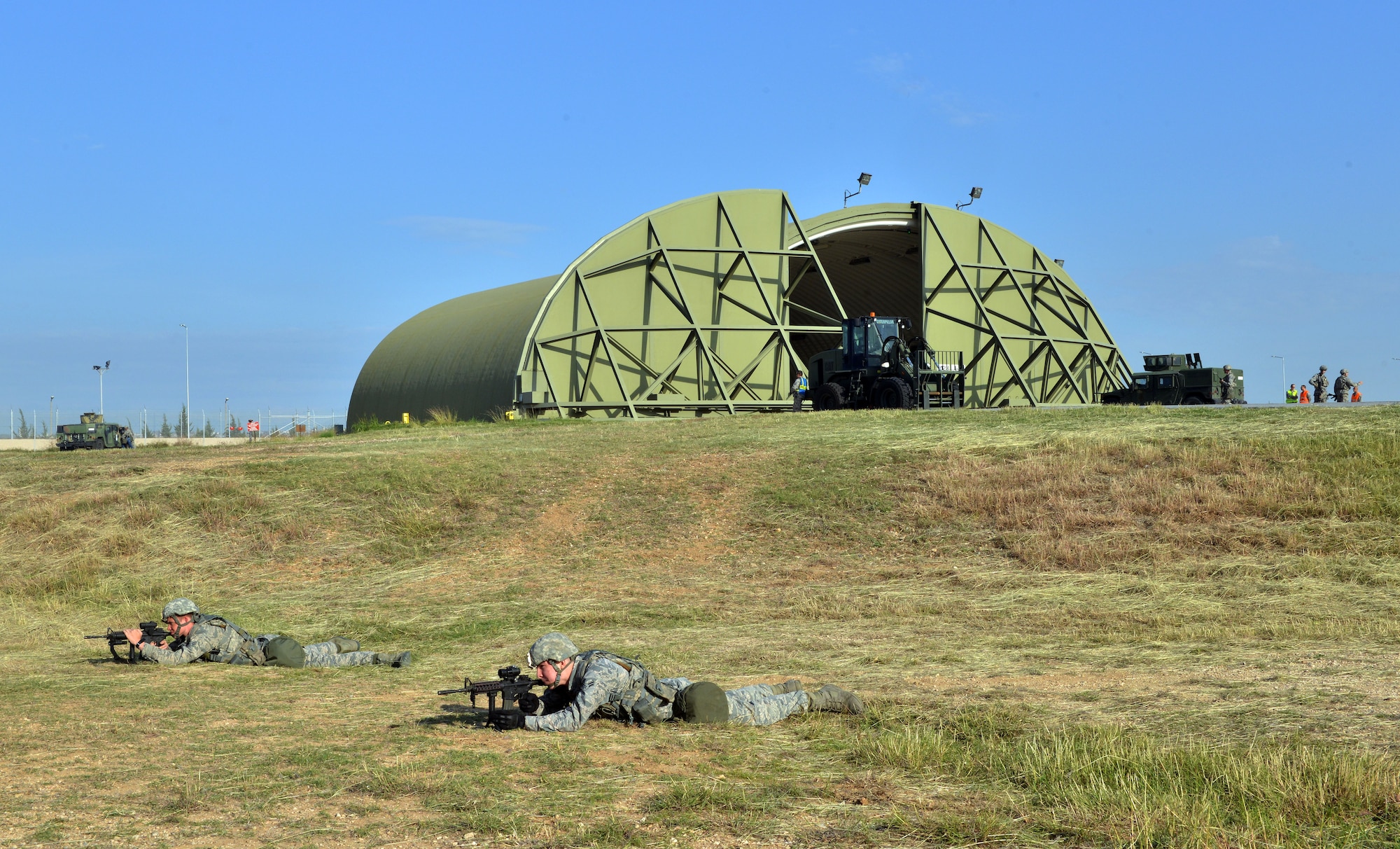 Members of the 39th Security Forces Squadron cordon off a building during a wing exercise Nov. 5, 2015, at Incirlik Air Base, Turkey. Members from the 39th SFS were responsible for holding the cordon around the simulated attacked area until the building was declared cleared. (U.S. Air Force photo by Staff Sgt. Michael Battles/Released)