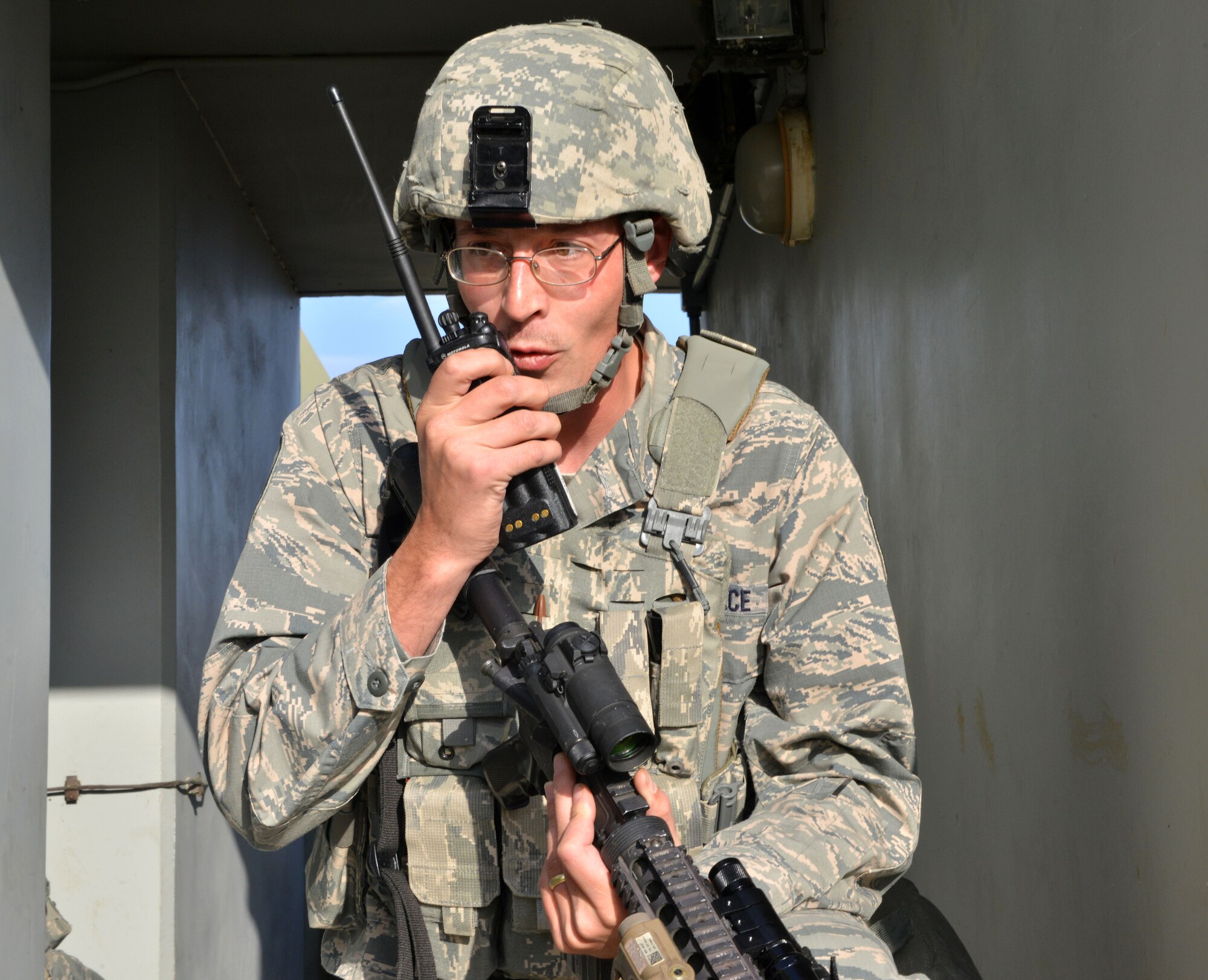 A member of the 39th Security Forces Squadron reports his situation during a wing exercise Nov. 5, 2015, at Incirlik Air Base, Turkey. As part of the exercise, members from the 39th SFS apprehended and subdued simulated members of opposing forces. (U.S. Air Force photo by Staff Sgt. Michael Battles/Released)
