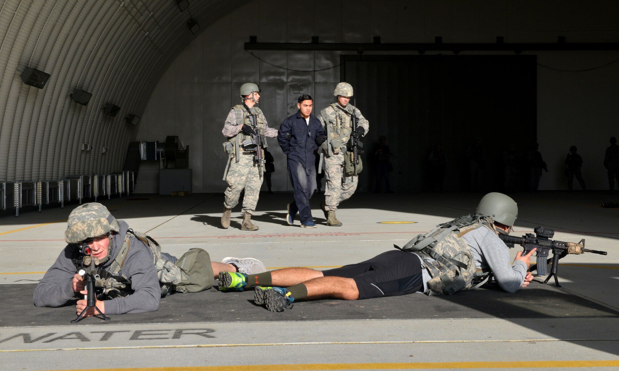 Members of the 39th Security Forces Squadron hold a defensive position during a wing exercise Nov. 5, 2015, at Incirlik Air Base, Turkey. Along with 39th SFS, personnel from the 39th Medical Group and the Incirlik Fire Department participated in the exercise. (U.S. Air Force photo by Staff Sgt. Michael Battles/Released)