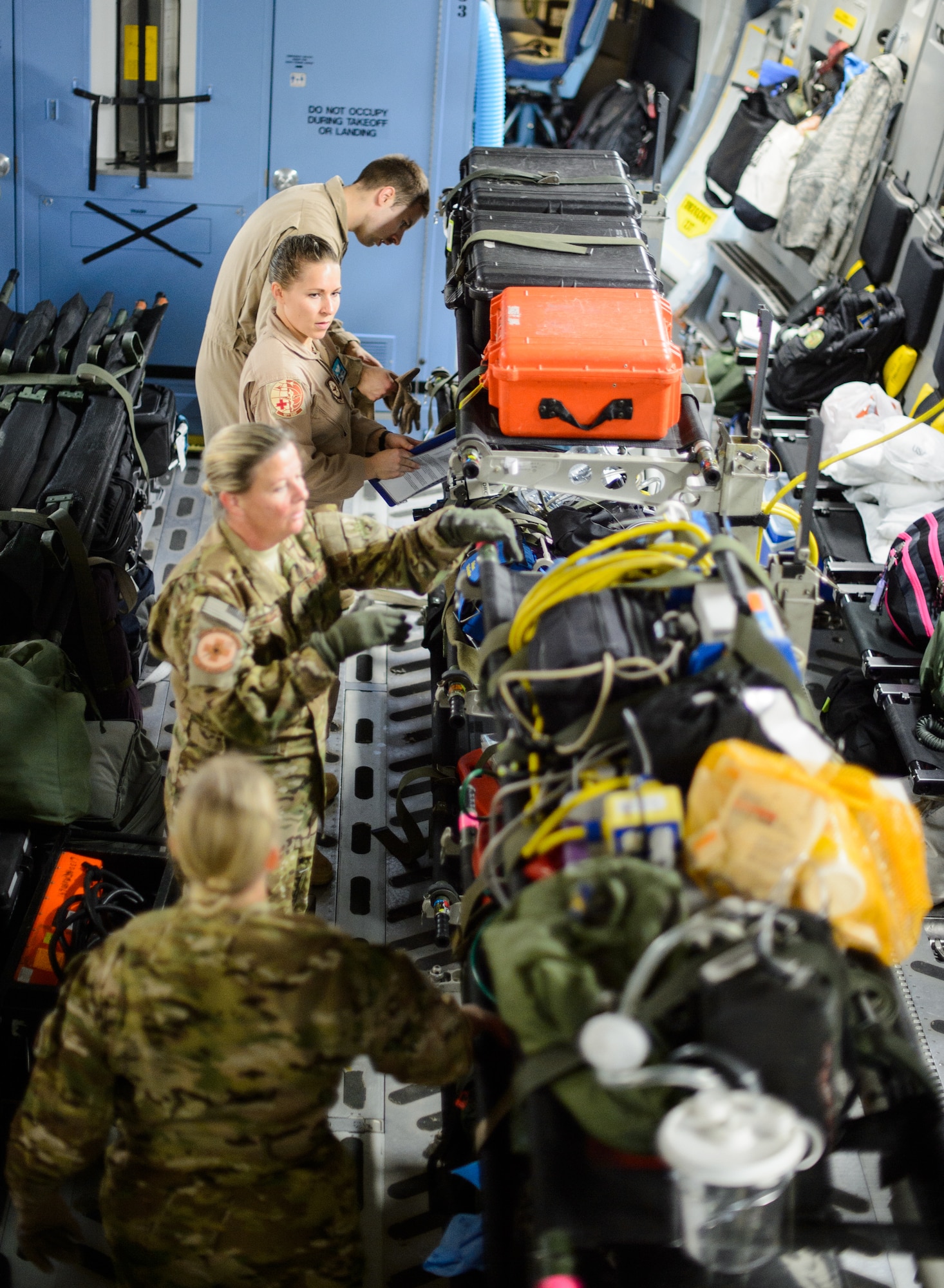 Medical personnel construct an aeromedical evacuation zone inside of a C-17 Globemaster III Nov. 10, 2015, at Ramstein Air Base, Germany. A variety of medical personnel, including Ramstein’s 10th Expeditionary Aeromedical Evacuation Squadron, flew to a deployed location to bring injured Airmen, Soldiers and Sailors to medical facilities capable of treating their injuries. (U.S. Air Force photo/Staff Sgt. Armando A. Schwier-Morales)