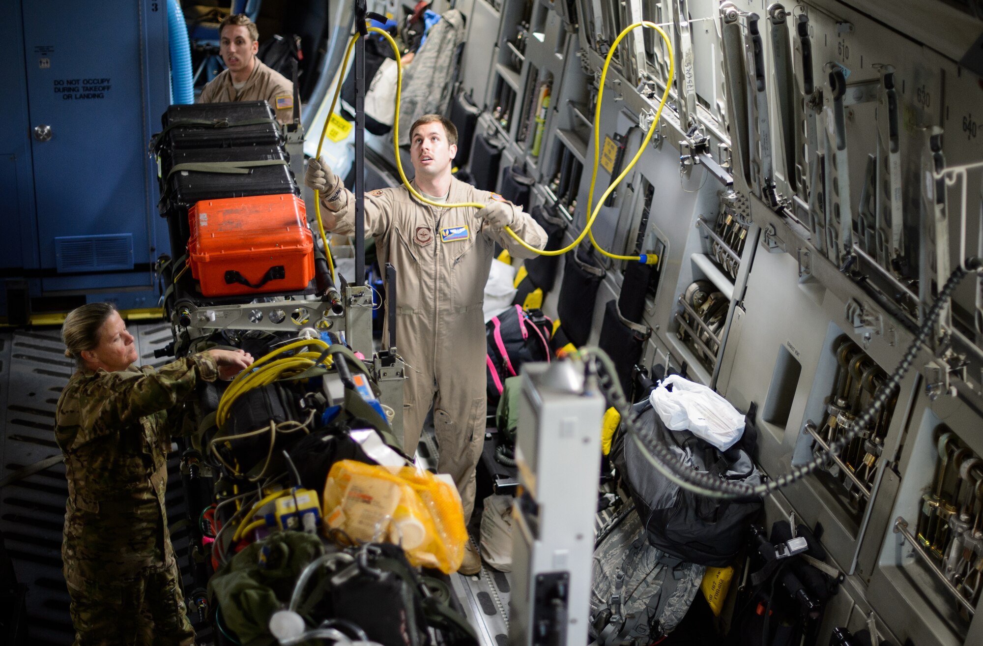 Tech. Sgt. Derek Matway, 10th Expeditionary Aeromedical Evacuation Squadron technician, sets up medical equipment inside a C-17 Globemaster III, Nov. 10, 2015, at Ramstein Air Base, Germany. Matway and a crew of medical Airmen flew to a deployed location in Southwest Asia to retrieve service members in need of medical attention. (U.S. Air Force photo/Staff Sgt. Armando A. Schwier-Morales)