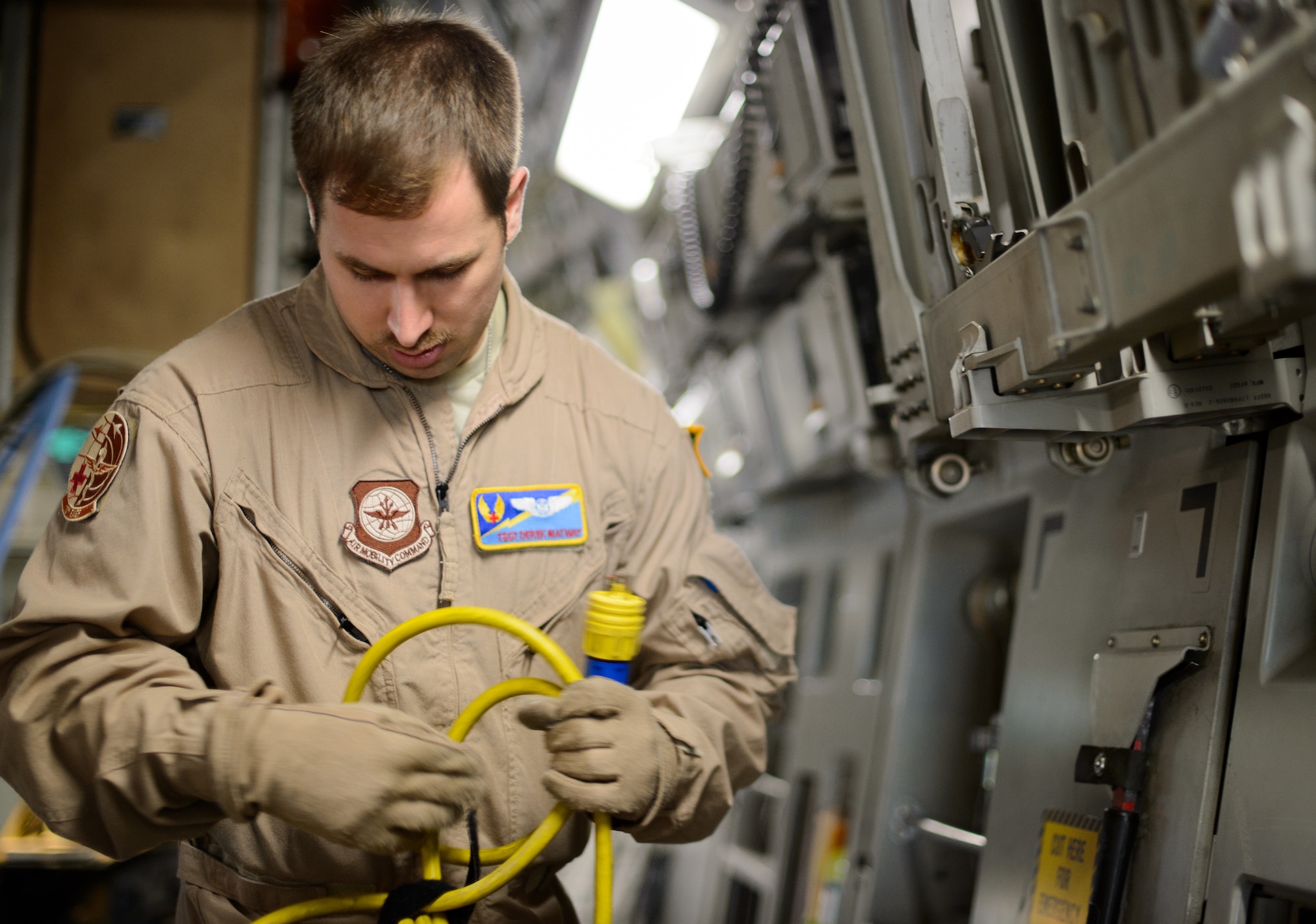 Tech. Sgt. Derek Matway, 10th Expeditionary Aeromedical Evacuation Flight technician, configures power for medical equipment Nov. 10, 2015, at Ramstein Air Base, Germany. Aeromedical evacuation Airmen can use a variety of aircraft in the Air Force arsenal to get the injured home and save lives. The aircraft powers the equipment needed to treat all types of injuries mid-flight. (U.S. Air Force photo/Staff Sgt. Armando A. Schwier-Morales)