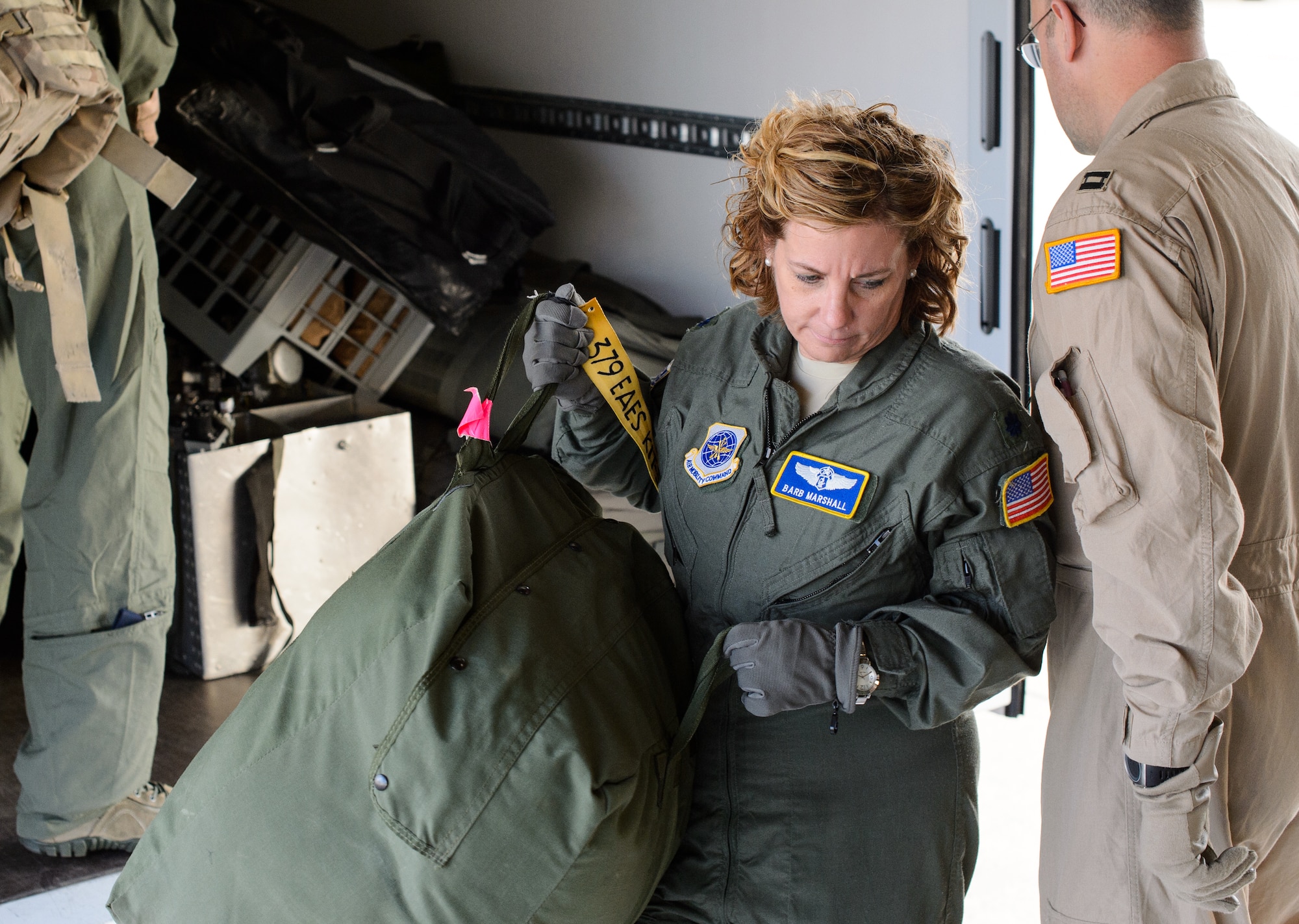 Lt. Col. Barb Marshall, 10th Expeditionary Aeromedical Evacuation Flight chief nurse, unloads a bag in preparation for an aeromedical evacuation sortie Nov. 10, 2015, at Ramstein Air Base, Germany. The flying crew and other members of the 10th EAEF help set up an aircraft to ensure medical personnel took off on time. (U.S. Air Force photo/Staff Sgt. Armando A. Schwier-Morales)