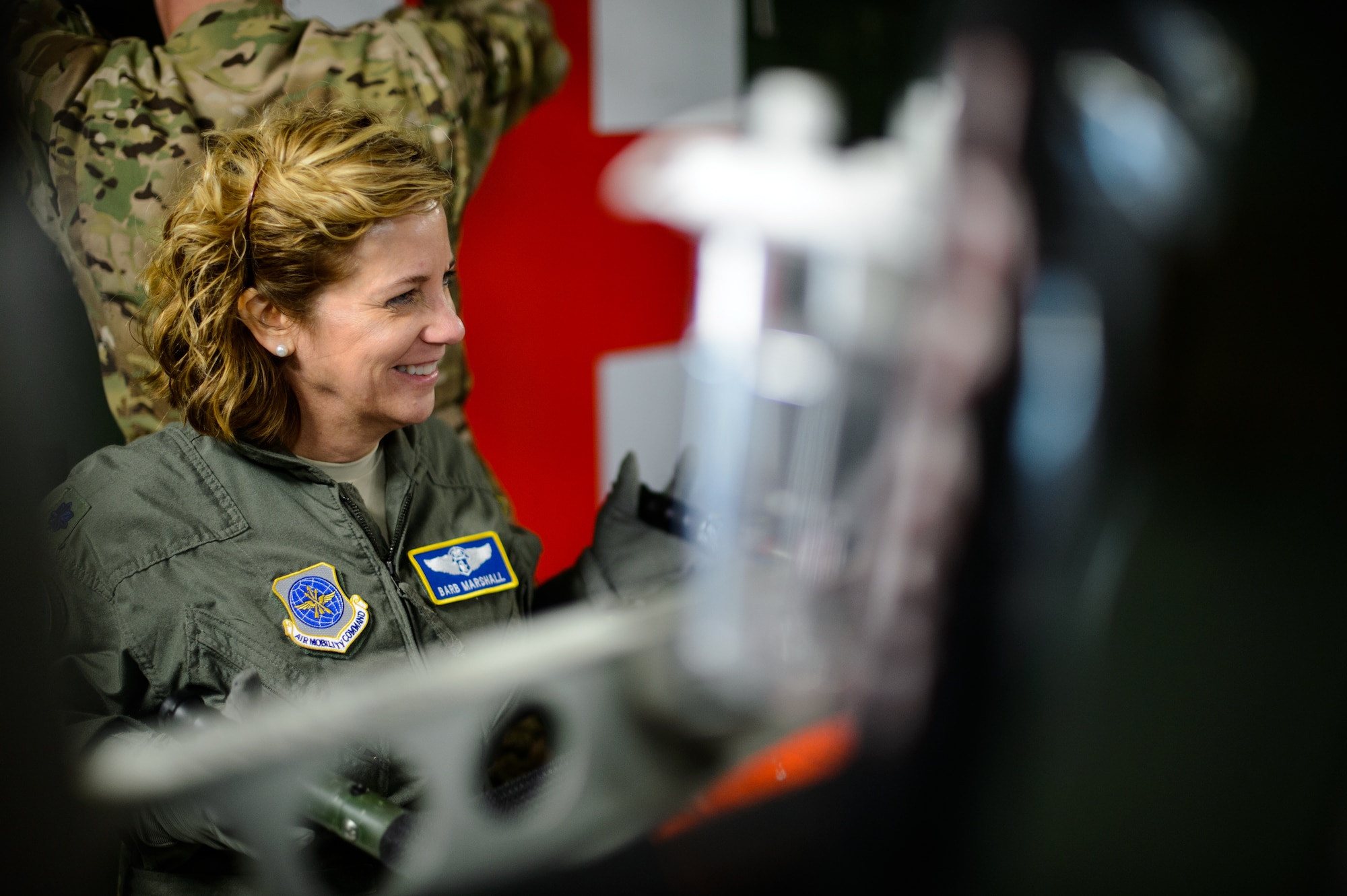Lt. Col. Barb Marshall, 10th Expeditionary Aeromedical Evacuation Flight chief nurse, carries a litter in preparation for an aeromedical evacuation sortie Nov. 10, 2015, at Ramstein Air Base, Germany. The flying crew and other members of the 10th EAEF help set up an aircraft to ensure medical personnel took off on time. (U.S. Air Force photo/Staff Sgt. Armando A. Schwier-Morales)