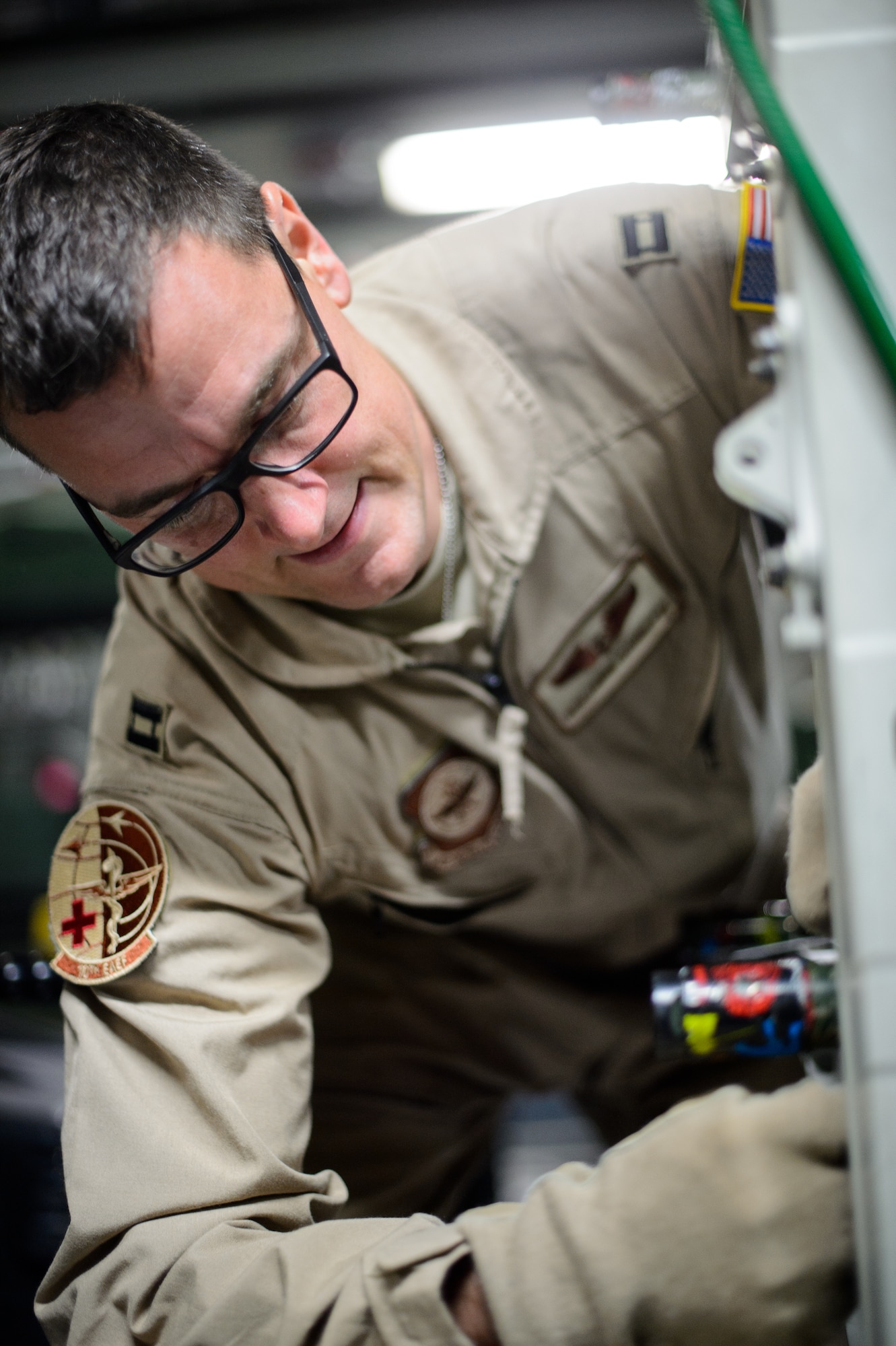 Capt. Benjamin Schultze, 10th Expeditionary Aeromedical Evacuation Flight nurse, secures a litter carrying medical equipment Nov. 10, 2015, at Ramstein Air Base, Germany. After configuring the inside of the C-17 Globemaster III into a flying ambulance, the Airmen test their equipment to ensure they can provide the best possible treatment while flying thousands of feet in the air. The 10th EAEF is a mixture of active-duty, reserve and guard Airmen deployed to Ramstein, constantly flying to war zones to retrieve patients needing higher levels of medical care. (U.S. Air Force photo/Staff Sgt. Armando A. Schwier-Morales)