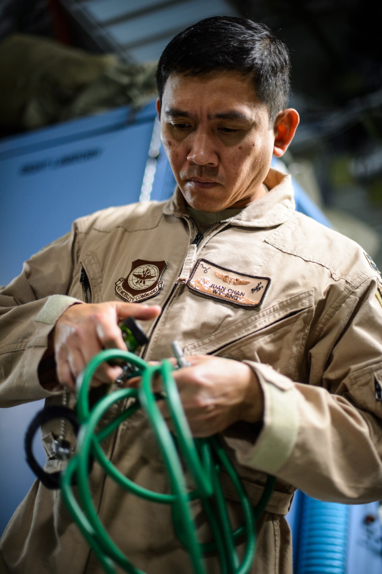 Capt. Juan Chan, 10th Expeditionary Aeromedical Evacuation Flight nurse, conducts a pre-flight test on medical equipment Nov. 10, 2015, at Ramstein Air Base, Germany. After configuring the inside of the C-17 Globemaster III into a flying ambulance, the Airmen test their equipment to ensure they can provide the best possible treatment while flying thousands of feet in the air. The 10th EAEF is a mixture of active-duty, reserve and guard Airmen deployed to Ramstein, constantly flying to war zones to retrieve patients needing higher levels of medical care. (U.S. Air Force photo/Staff Sgt. Armando A. Schwier-Morales)