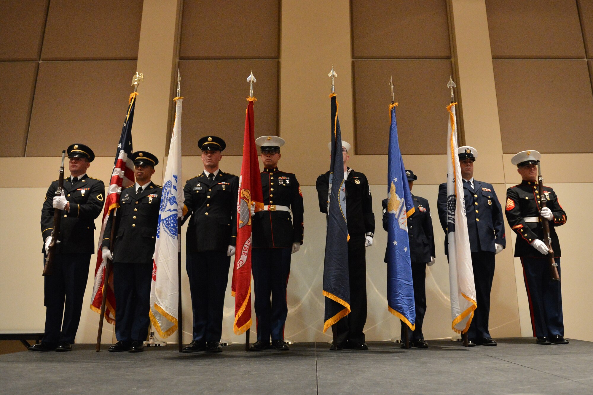 Members of the Aerospace Data Facility-Colorado Joint Color Guard post colors during the Veterans Day ceremony at the Leadership Development Center Nov. 13, 2015, on Buckley Air Force Base, Colo. The ceremony included a guest speaker and a flag-folding ceremony performed by the ADF-C joint color guard. (U.S. Air Force photo by Staff Sgt. Darren Scott/Released)
