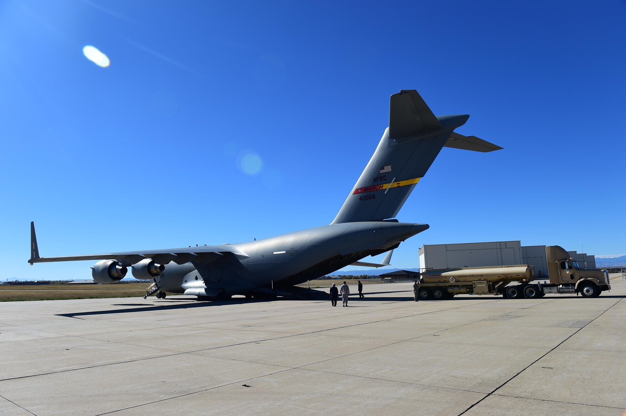 Wing leadership oversees the 233rd Space Group’s mobile ground station load onto a C-17 Globemaster III during Panther Thunder Nov. 2, 2015, on Buckley Air Force Base, Colo.  The exercise scenario tested the 233rd SG’s ability to rapidly deploy their assets in case of satellite failure. Panther Thunder is Buckley AFB's version of the Strategic Command exercise, Global Thunder, which is an Air Force-wide exercise that focuses on all combatant commands and their missions.  (U.S. Air Force photo by Airman 1st Class Samantha Meadors/Released)