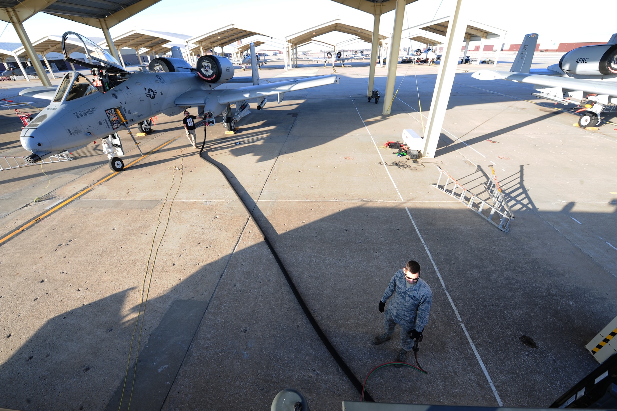 U.S. Air Force Airman 1st Class Jacob McSheffrey, a 509th Logistics Readiness Squadron fuels distribution operator, fuels an A-10 Thunderbolt II at Whiteman Air Force Base, Mo., Nov. 3, 2015. The fuels shop mission is to ensure aircraft, vehicles and equipment receive fuel with a minimal amount of water and contains no contaminants. (U.S. Air Force photo by Senior Airman Keenan Berry)