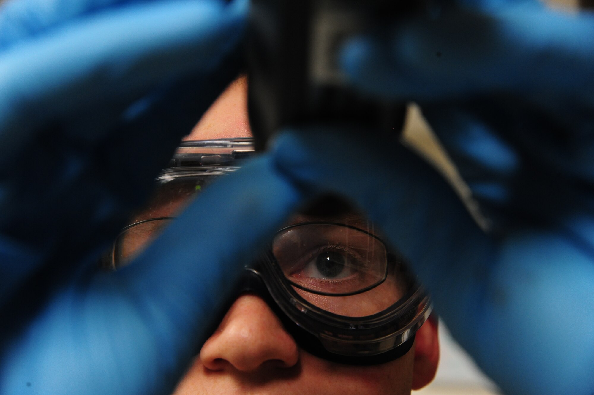 U.S. Air Force Staff Sgt. Nicholas Flamm, a 509th Logistics Readiness Squadron fuels service center operator, utilizes a refractometer to measure fuel system icing inhibitor (FSII) levels at Whiteman Air Force Base, Mo., Nov. 3, 2015. This process ensures the FSII levels meet the Air Force specifications and keeps ice crystals from forming in the fuel during flight. (U.S. Air Force photo by Senior Airman Keenan Berry)