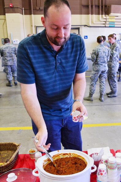 A Team Malmstrom member attends the inaugural 341st Mission Support Group Chili Cook Off Nov. 6, 2015, at Malmstrom Air Force Base, Mont. Approximately 75 Airmen from all across the base came out to enjoy tasting from several different chilies. (U.S. Air Force photo/Airman Daniel Brosam)