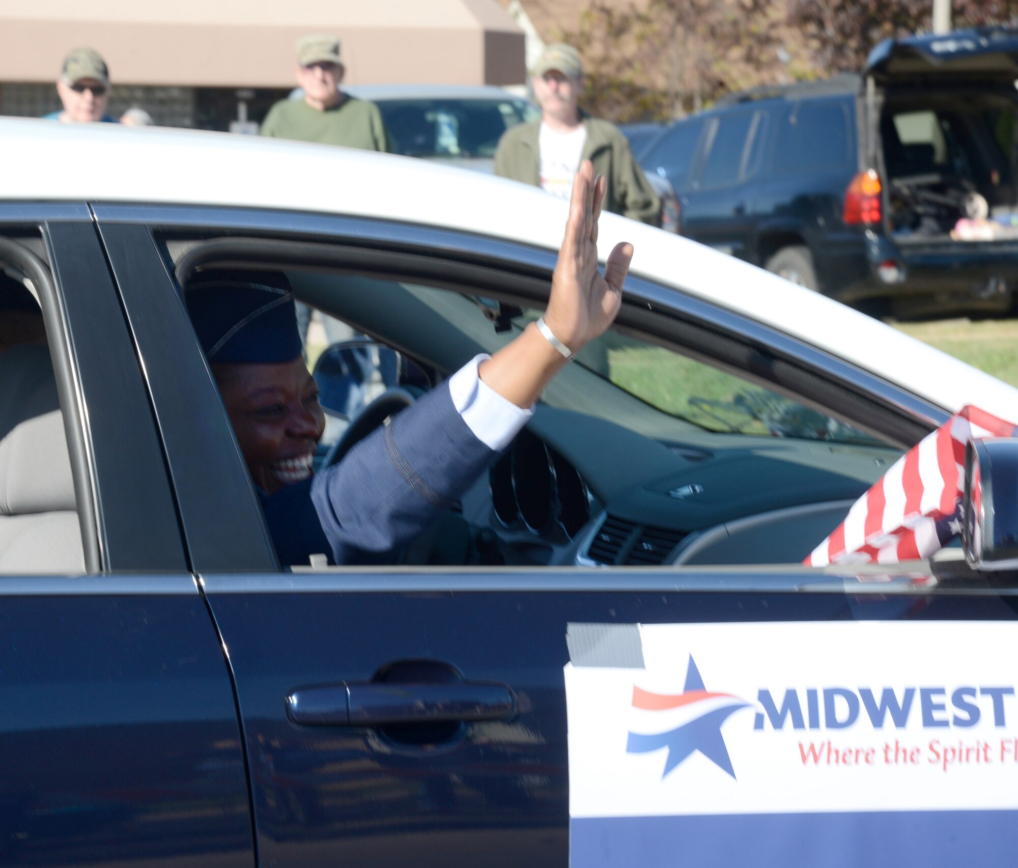Col. Stephanie Wilson, 72nd Air Base Wing and Tinker installation commander, waves to crowds of people during the 2015 Veterans Day Parade in Midwest City. (Air Force photo by Kelly White/Released)

