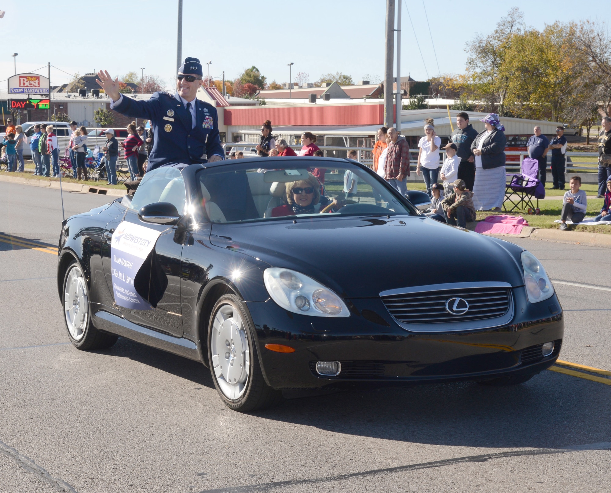 Air Force Sustainment Center Commander Lt. Gen. Lee Levy II waves to the crowd during the 2015 Midwest City Veterans Day Parade Wednesday. General Levy served as the parade’s grand marshal.  (Air Force photo by Kelly White/Released)
