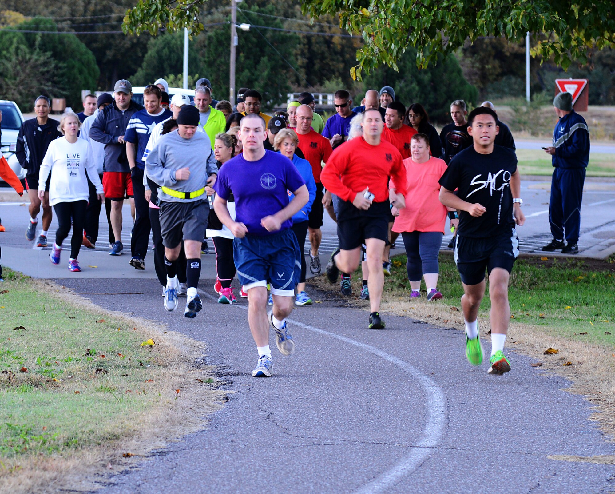 Runners take off at the start of the Halloween After Party 5K Fun Run/Walk on Nov. 6 at the Tinker Club. The free run garnered $316 in donations to be presented to the Tinker Youth Center as part of the 2015 Combined Federal Campaign. The CFC theme this year is “Love Your Community to the Moon and Back.” Several organizations contributed to make the run a success, including the Tinker Chapel, which donated T-shirts for the participants, and Network 5/6, donating water and Gatorade to the runners. (Air Force photo by Kelly White/Released)