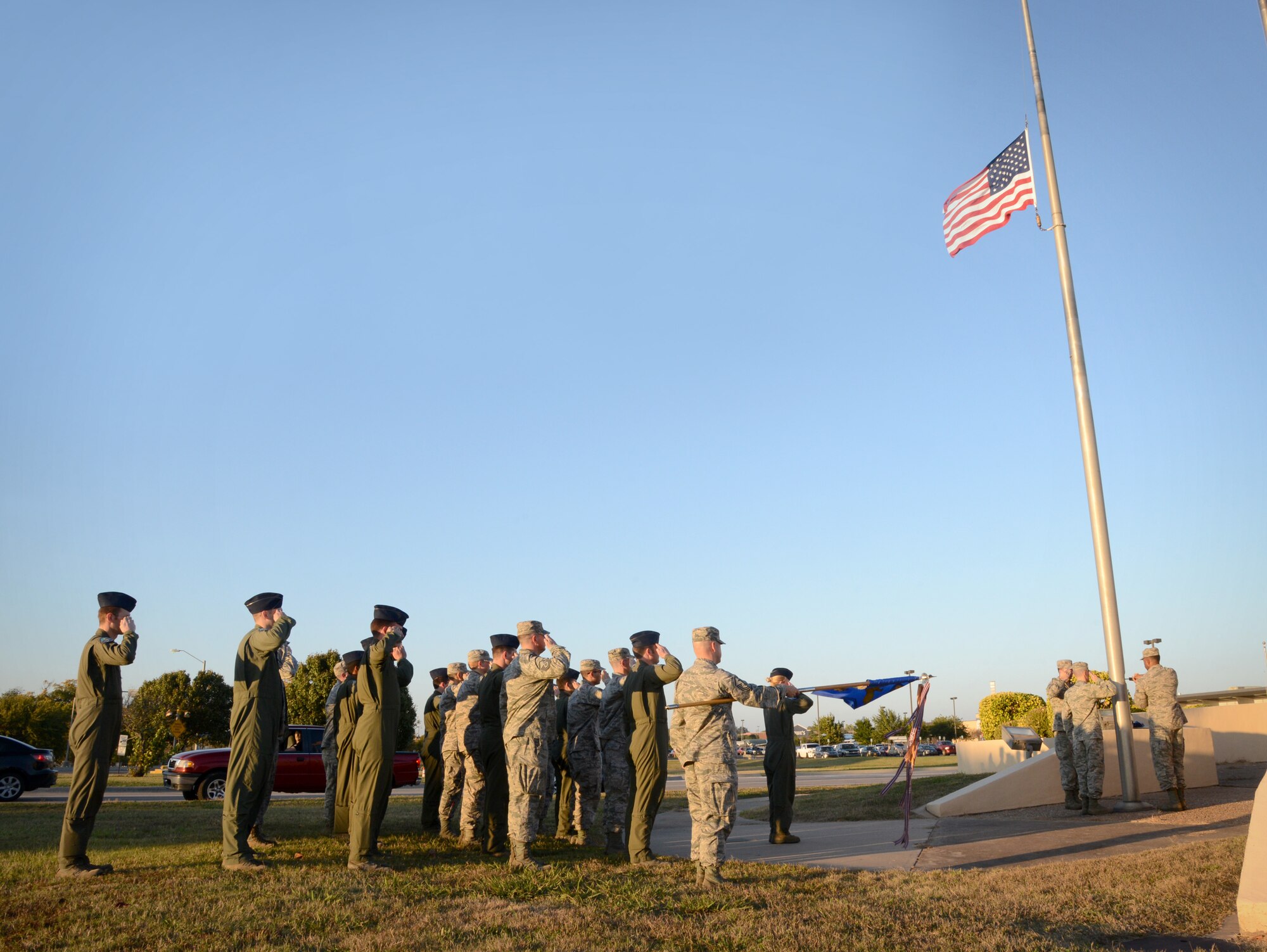 Members of the 552nd Air Control Wing’s Operations Group participated in a base retreat ceremony on Nov. 3. Led by 960th Airborne Air Control Squadron Commander Lt. Col. Kristen D. Thompson, the 24-member group stood at attention as the flag was lowered and folded by the Tinker Honor Guard. (Air Force photo by Kelly White/Released)
