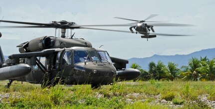 Two UH-60 Blackhawks assigned to the 1-228th Aviation Regiment at Soto Cano Air Base, Honduras, fulfill a request from the Honduran Military to provide airlift for a troop rotation, Nov. 4, 2015, in the Gracias a Dios department (state) of Honduras. The U.S. has supported the Honduran request since October 2014, and is a partnership to allow greater freedom of movement for the Honduran military in remote areas of the country. (U.S. Air Force photo by Capt. Christopher J. Mesnard/Released)