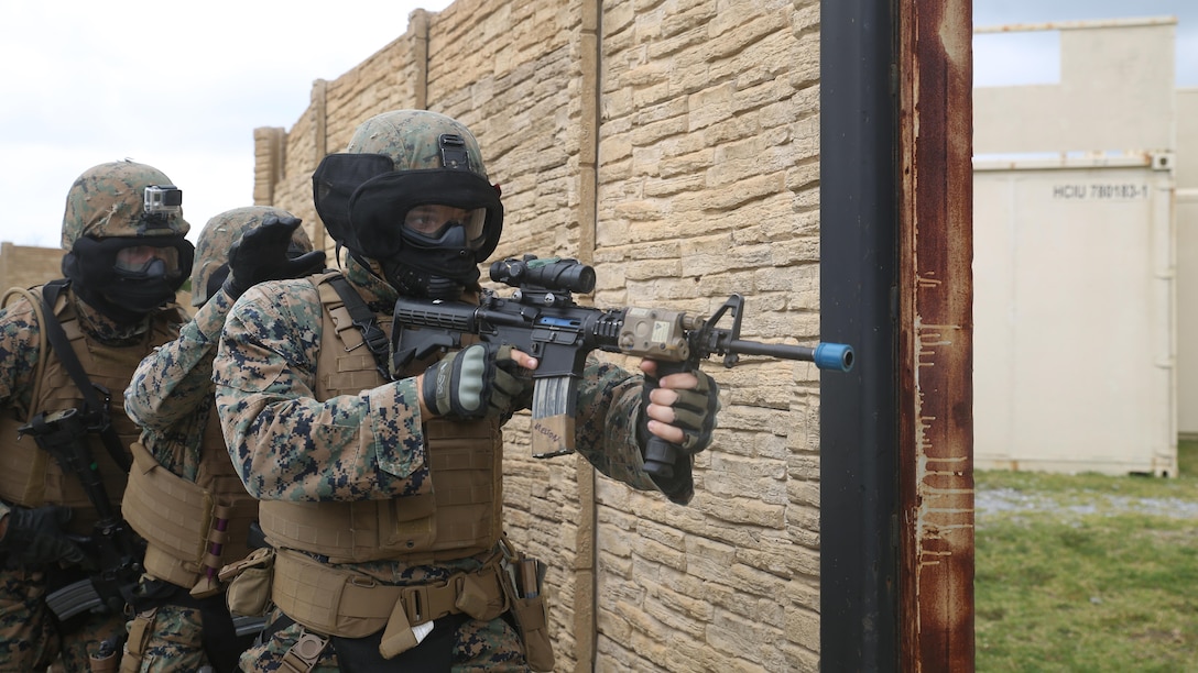 Lance Cpl. Caleb Melton leads a fire team of Marines to clear a building during a training evolution in Central Training Area’s Combat Town in Okinawa, Japan, Nov. 4, 2015. The Marines, with Military Police Detachment, Combat Logistics Battalion 31, 31st Marine Expeditionary Unit, conducted a three day training event to advance their skills clearing buildings. Melton is from Phoenix, Arizona, and is a military policeman with CLB 31, 31st MEU. 