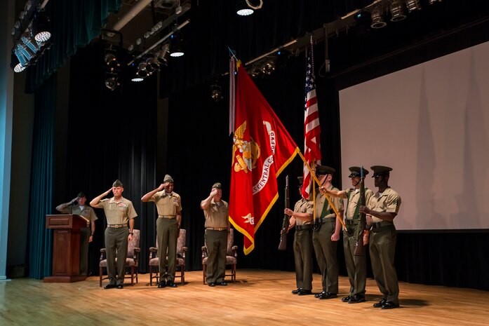 U.S. Marine Corps Maj. Gen. Carl E. Mundy III, commanding general, second from left, and Sgt. Maj. Clifford Wiggins, sergeant major, third from left, both with the 5TH Marine Expeditionary Brigade (MEB), salute the colors during the unit's activation ceremony aboard Naval Support Activity Bahrain, Oct. 15, 2015. The unit formerly known as Command Element Marine Forces Central Command Forward was re-designated as the 5TH MEB to more accurately reflect Marine Corps organizational doctrine, and will continue to provide a forward-deployed headquarters in the U.S. Central Command area of responsibility. (U.S. Marine Corps photo by Cpl. Sean Searfus 5TH MEB COMCAM / Released)