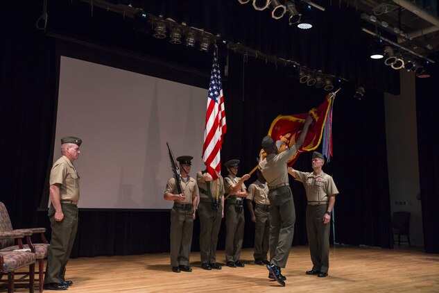 U.S. Marine Corps Sgt. Maj. Clifford W. Wiggins, sergeant major, second from right, and Maj. Gen. Carl E. Mundy III, commanding general, far right, both with the 5TH Marine Expeditionary Brigade (MEB) unfurl the unit colors during the activation ceremony of the 5th MEB on Naval Support Activity Bahrain, Oct. 15, 2015. Command Element Marine Forces Central Command Forward was re-designated as the 5TH MEB to more accurately reflect Marine Corps organizational doctrine, and will continue to provide a forward-deployed headquarters in the U.S. Central Command area of responsibility. (U.S. Marine Corps photo by Cpl. Sean Searfus 5TH MEB COMCAM / Released)