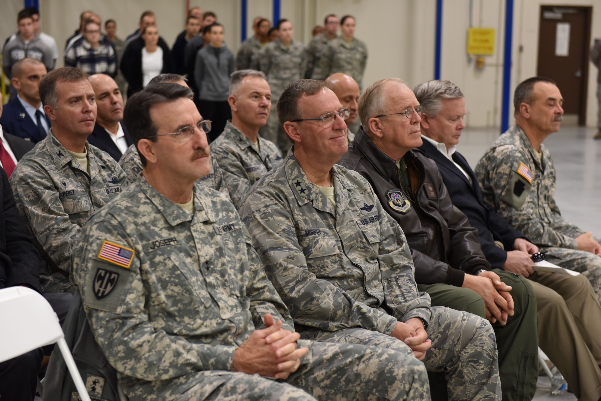 (From left to right) Army Maj. Gen. James Joseph, Pennsylvania adjutant general; Maj. Gen. John Murphy, assistant adjutant general, Pennsylvania Air National Guard; and Maj. Gen. Eric Weller, U.S. Special Operations Command deputy commander of mobilization and reserve affairs (and former commander of the 193rd Special Operations Wing), show their support for Col. Benjamin (Mike) Cason as he assumes command of the 193rd SOW, during a change-of-command ceremony on base Nov. 14. Cason is the first dual-status commander of an Air Force Special Operations Command unit. (U.S. Air National Guard photo by Senior Airman Ethan Carl/Released)
