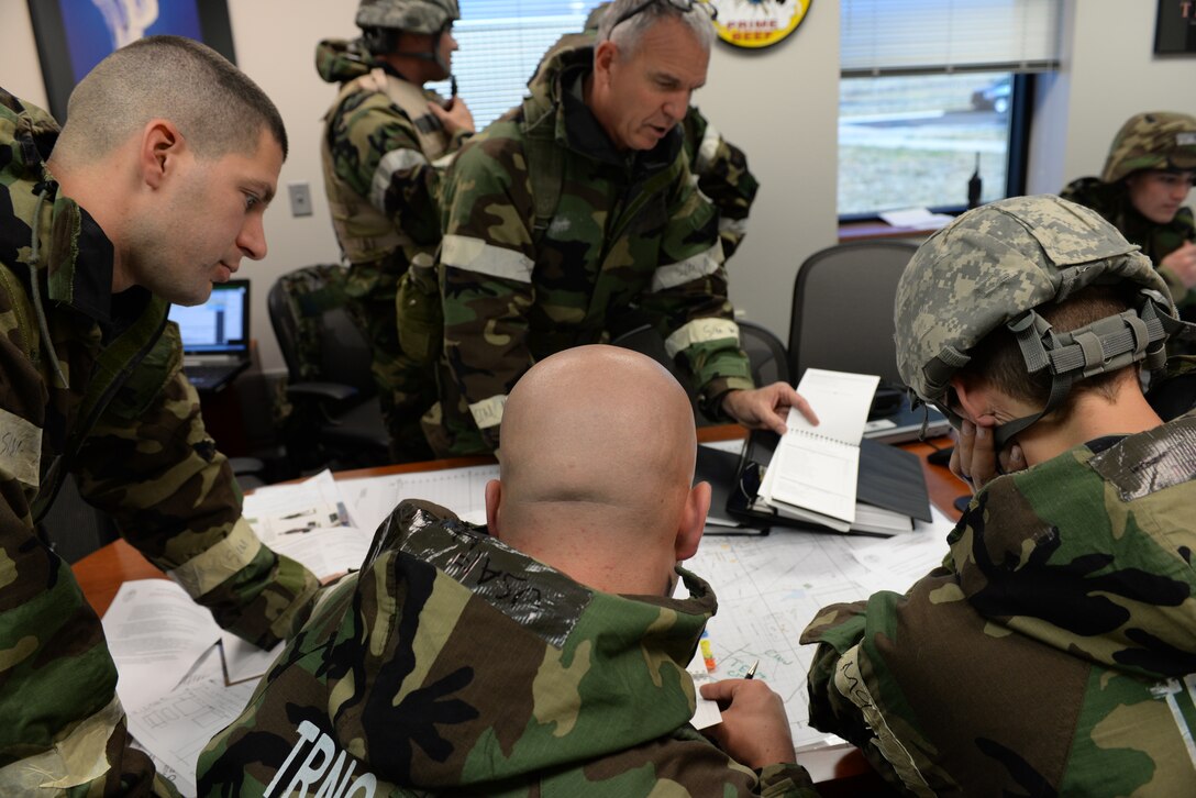 U.S. Airmen, assigned to 140th Civil Engineering Squadron, design force packages at the unit control center on Buckley Air Force Base in Aurora, Colo., during the wing wide readiness inspection Oct. 16, 2015. The UCC is set up during a crisis to prepare and coordinate resources needed in a real world war situation.  (U.S. Air National Guard photo by Senior Airman Bobbie Reynolds)