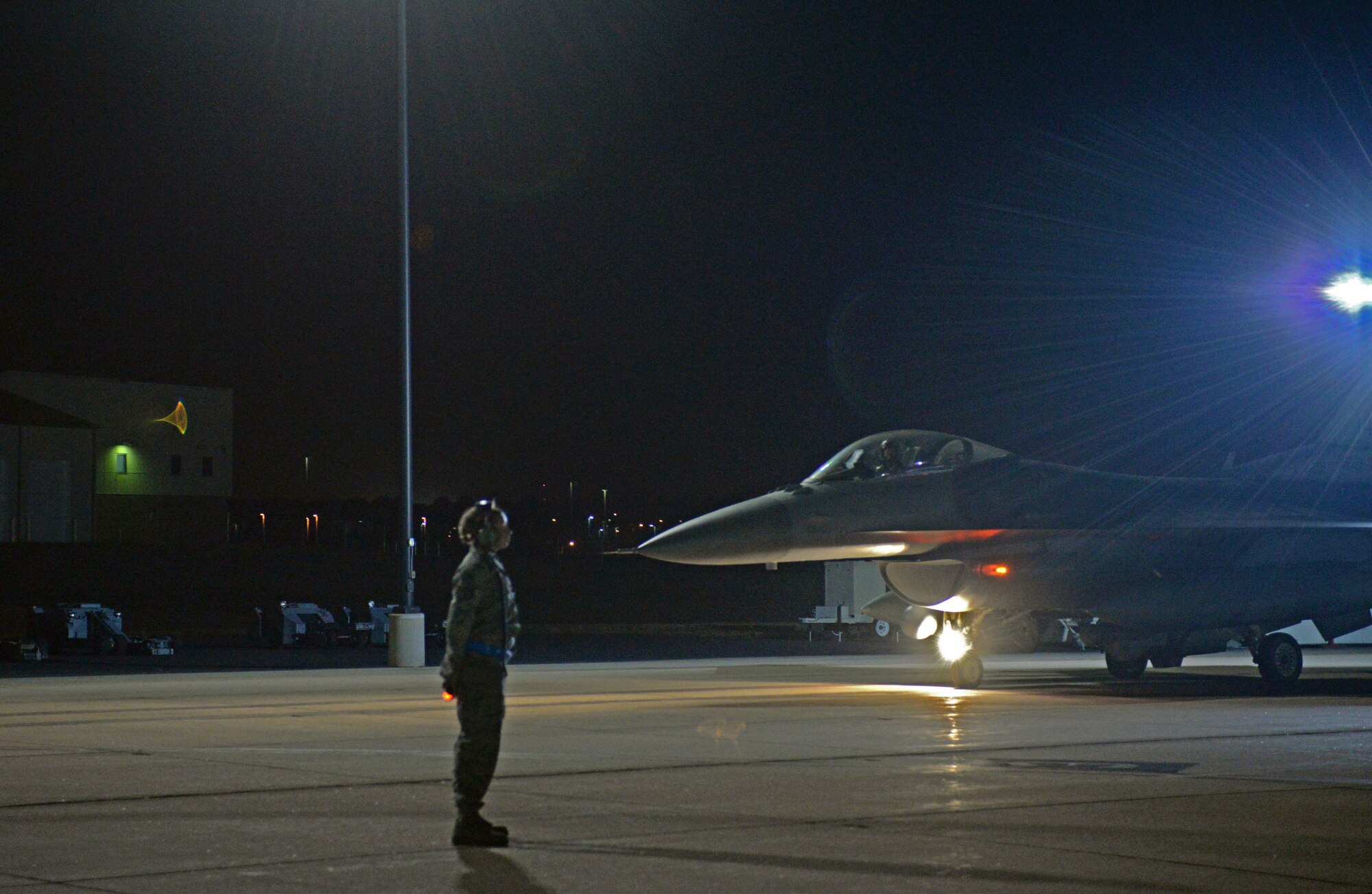 U.S. Air Force Staff Sgt. Elizabeth N. Lucero, a crew chief assigned to the 140th Maintenance Squadron, Colorado Air National Guard, waits to taxi a jet out to the run-way at Buckley Air Force Base, Colo., during the wing wartime readiness inspection Oct. 16, 2015. Crew chiefs are essential to ensuring jets are fit to fly at all times. (U.S. Air National Guard photo by Senior Airman Bobbie Reynolds)