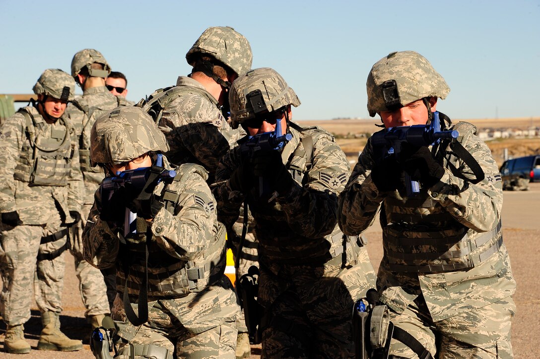 Colorado Air National Guard Airmen from the 140th Security Forces Squadron train for real world events using shoot, move, and communicate role based scenarios at Buckley Air Force Base, Colo. Nov. 15, 2015. These types of settings educate Airmen to enter, search, and exit an area while being alert and providing security for others on the team. (U.S. Air National Guard photo by Tech. Sgt. Nicole Manzanares)