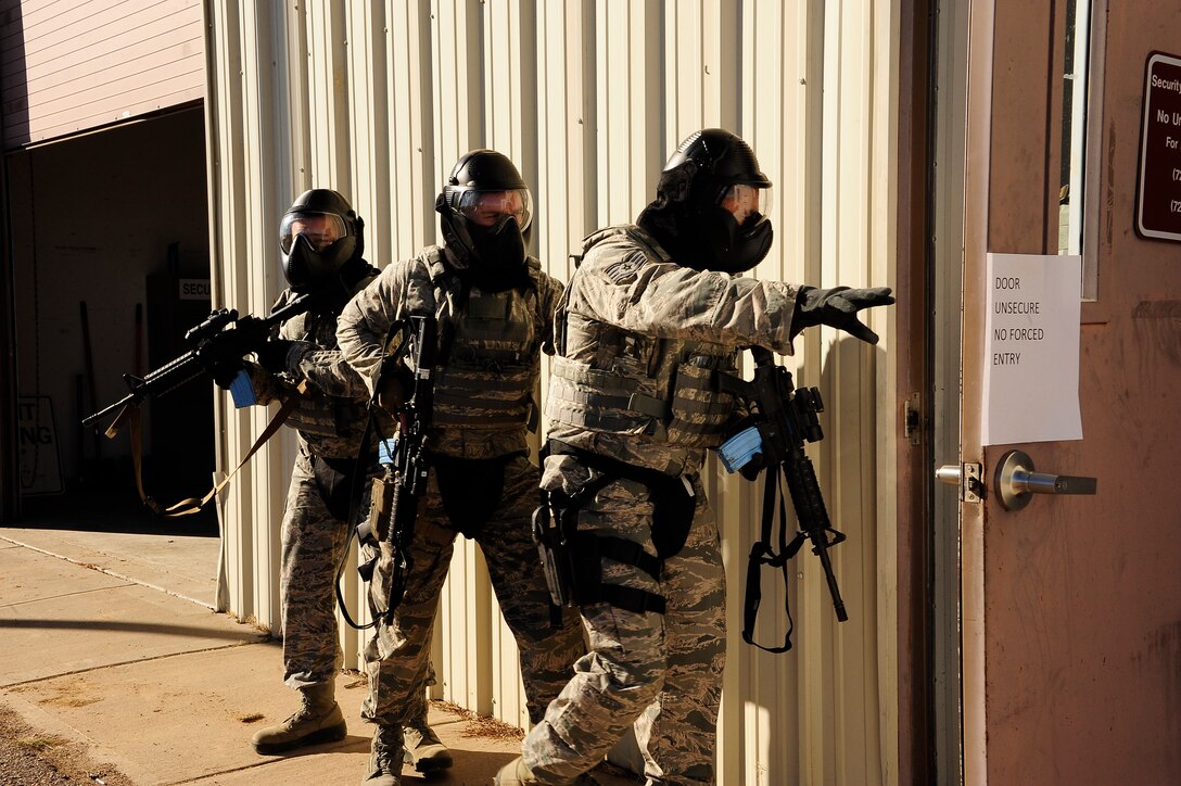 Colorado Air National Guard Airmen from the 140th Security Forces Squadron perform a “stacking” maneuver as they train on real world scenarios at Buckley Air Force Base, Colo., Nov. 15, 2015.These types of settings educate Airmen to enter, search, and exit an area while being alert and providing security for others on the team. (U.S. Air National Guard photo by Tech. Sgt. Nicole Manzanares)