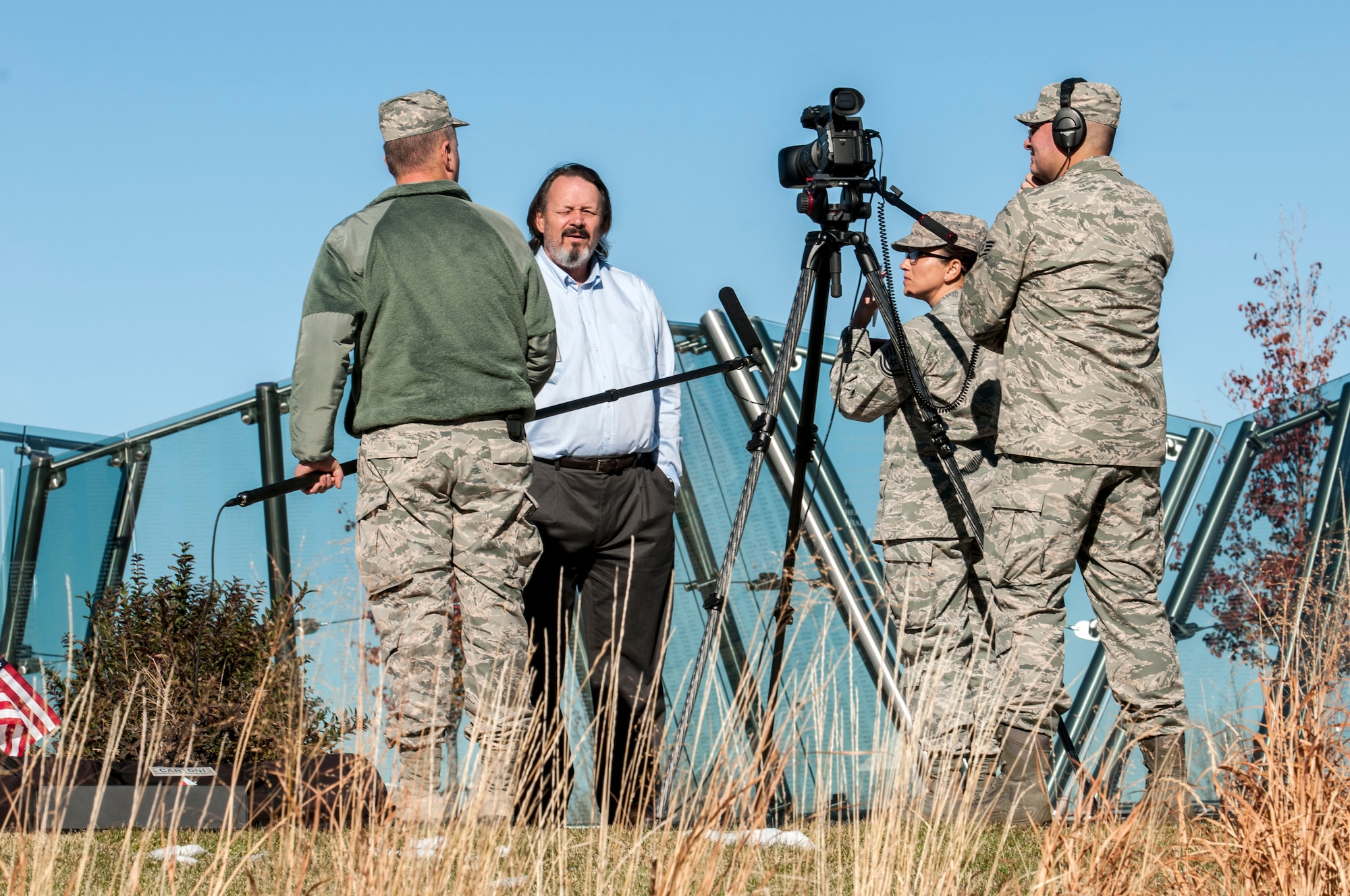 U.S. Airmen, assigned to the 140th Public Affairs Office, interview Rick Crandall, president of the Colorado Freedom Memorial, about how the Memorial was inspired and built in Aurora, Colo. May 14, 2015.  The memorial honors Colorado men and women killed in action since Colorado first became a state. (U.S. Air National Guard Senior Airman Bobbie Reynolds)