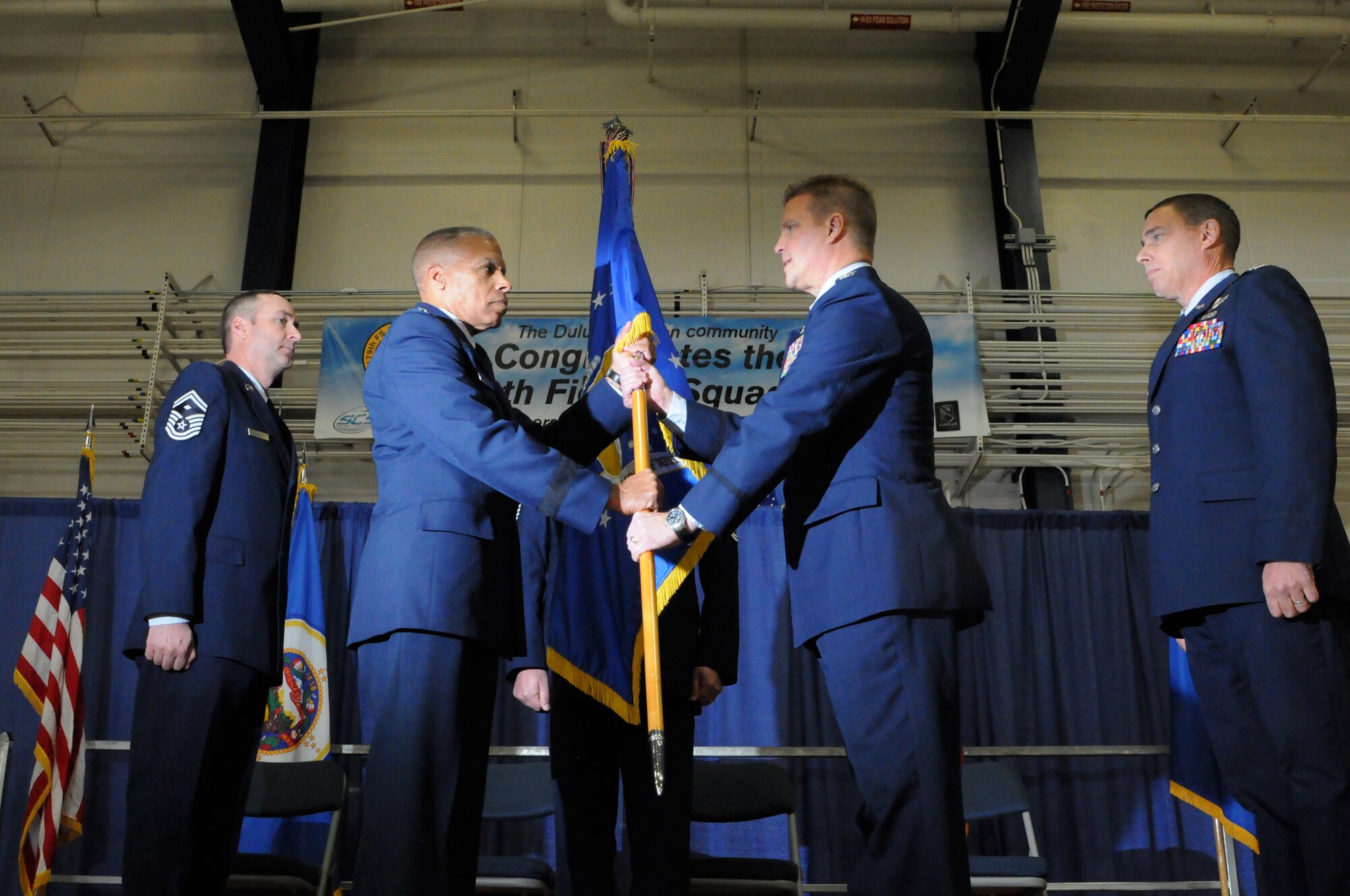 Col. Jon S. Safstrom accepts command of 148th Fighter Wing, Duluth, Minn. from  Brig. Gen. David D. Hamlar, Assistant Adjutant General, Minnesota National Guard, Nov. 14, 2015. Safstrom assumed command from Col. Frank H. Stokes who accepted a position at the National Guard Bureau, Arlington, Va. (U.S. Air Force photo by Tech. Sgt. Amie Muller/released)