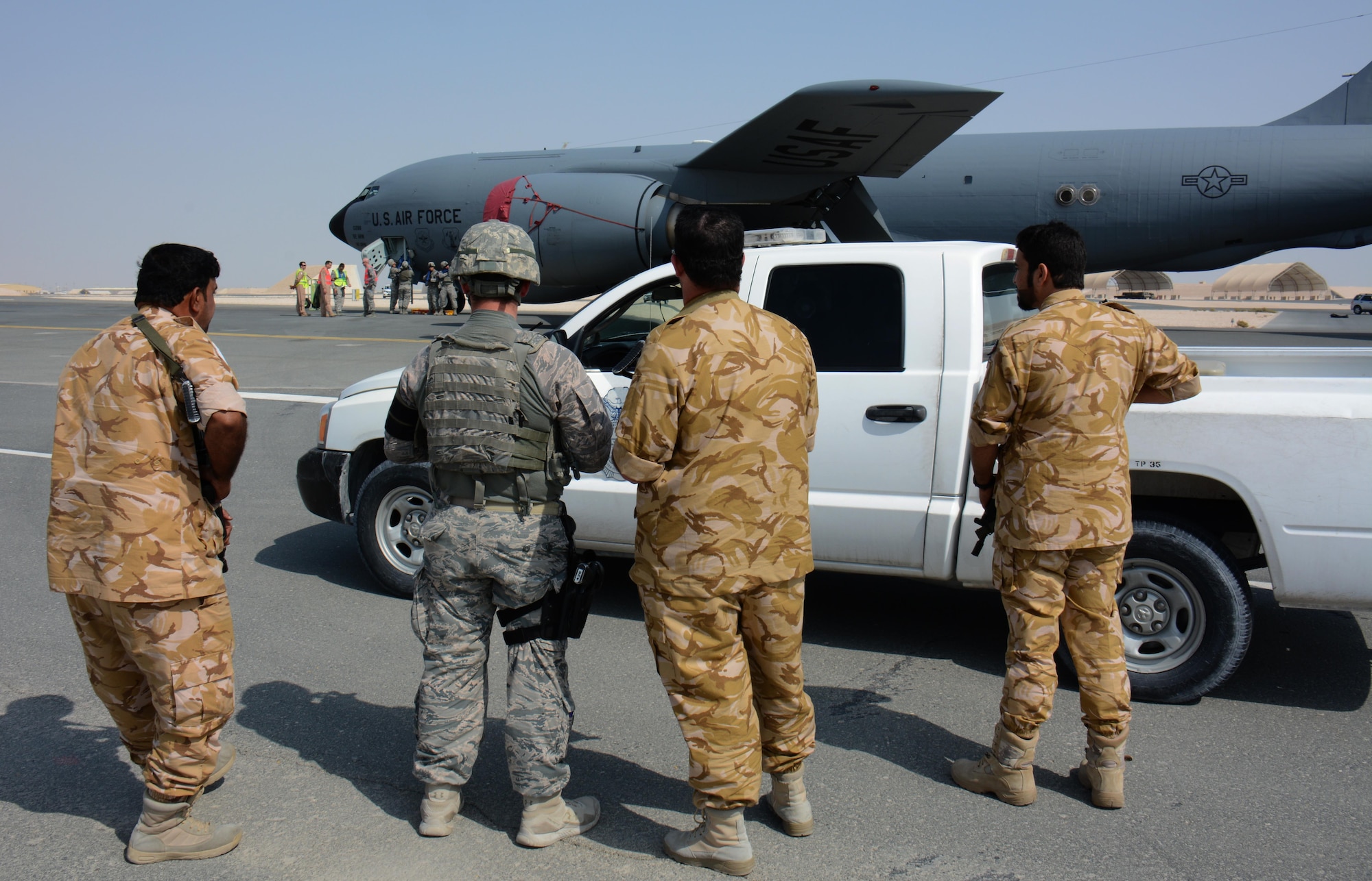 U.S. airmen and airmen from the Qatar Emir Air Force respond to a force protection exercise at Al Udeid Air Base, Qatar Nov. 12. The exercise featured an attempted aircraft hijacking. (U.S. Air Force photo by Tech. Sgt. James Hodgman)