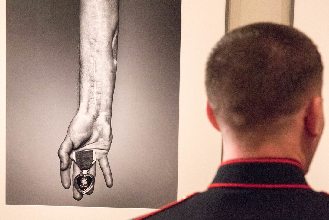 Marine Corps Cpl. Kyle Carpenter observes his portrait at the National Portrait Gallery in Washington, D.C., Nov. 15, 2015. DoD photo by D. Myles Cullen