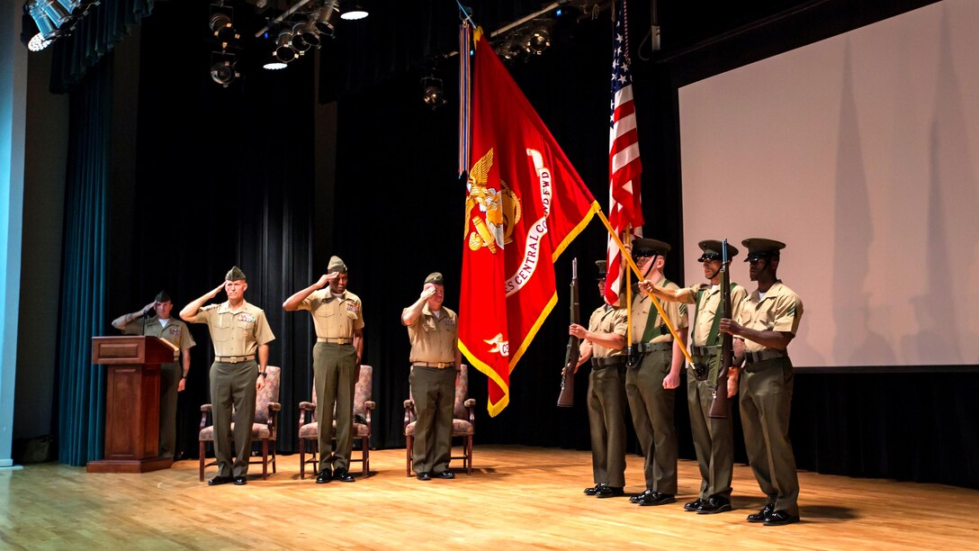 U.S. Marine Corps Maj. Gen. Carl E. Mundy III, commanding general 5th Marine Expeditionary Brigade, second from left, and Sgt. Maj. Clifford Wiggins, sergeant major 5th Marine Expeditionary Brigade, third from left, salute the colors during the unit's activation ceremony at Naval Support Activity Bahrain, Oct. 15, 2015. The unit formerly known as Command Element Marine Forces Central Command Forward was re-designated as the 5th MEB to more accurately reflect Marine Corps organizational doctrine, and will continue to provide a forward-deployed headquarters in the U.S. Central Command area of responsibility