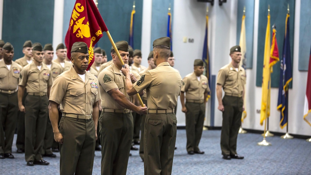 The Command Element Marine Forces Central Command Forward guidon is retired during the 5th Marine Expeditionary Brigade activation ceremony at Naval Support Activity Bahrain, Oct. 15, 2015. Command Element Marine Forces Central Command Forward was re-designated as the 5TH MEB to more accurately reflect Marine Corps organizational doctrine, and will continue to provide a forward-deployed headquarters in the U.S. Central Command area of responsibility