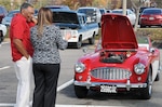 (From left) Retired Army Col. Ray Willis discusses his 1958 Austin-Healey with a spectator at the Combined Federal Campaign Motorcycle and Car Show Nov. 5 at the McNamara Headquarters Complex. 