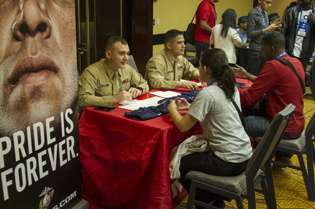1st Lt. Craig Muma and Capt. Juan Chavez interview applicants for their Extreme Engineering Challenge Team during the 2015 Society of Hispanic Professionals and Engineers Symposium in Baltimore, Md., Nov. 11, 2015. Students were given 24 hours to complete an engineering challenge with Muma and Chavez to guide and motivate them along the way. Muma currently serves as reserve support at Marine Corps Recruiting Command in Quantico, Va., and Chavez serves as a recruiting support officer, Recruiting Station Albuquerque.